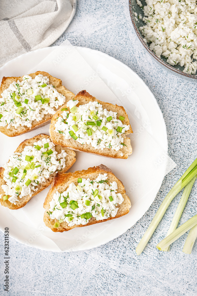 Sandwiches with tasty cottage cheese and green onion on grey background