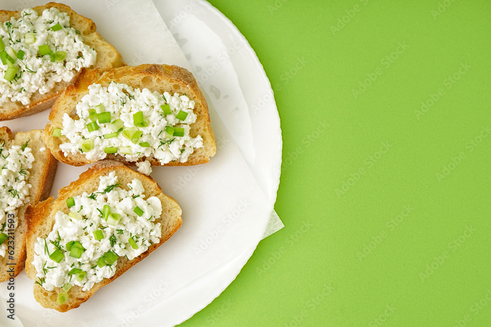 Sandwiches with tasty cottage cheese and green onion on color background