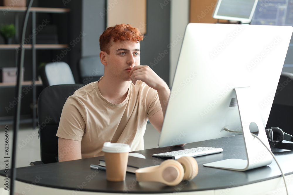 Male programmer working in office