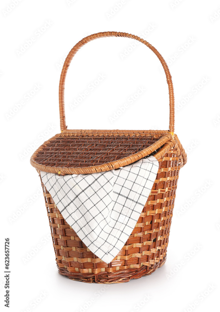 Wicker picnic basket with napkin isolated on white background