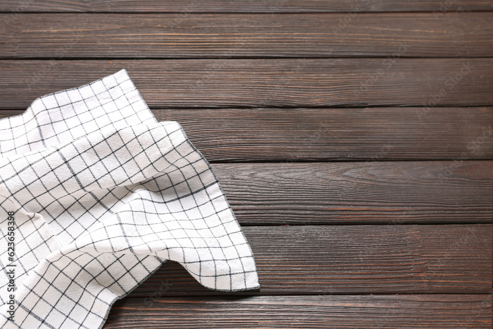 Clean napkin on dark wooden background