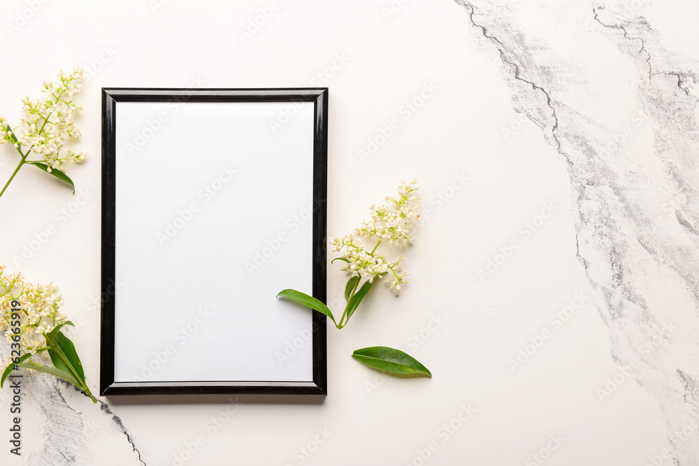 Blank photo frame and beautiful lilac flowers on white background