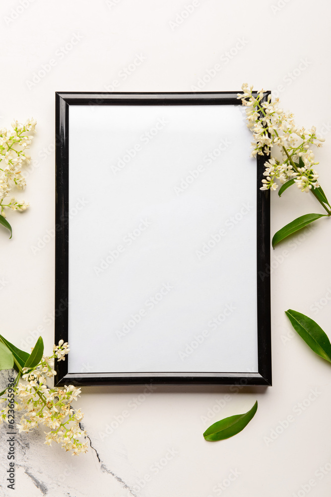 Blank photo frame and beautiful lilac flowers on white background