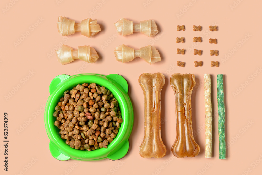 Composition with different dog treats on color background