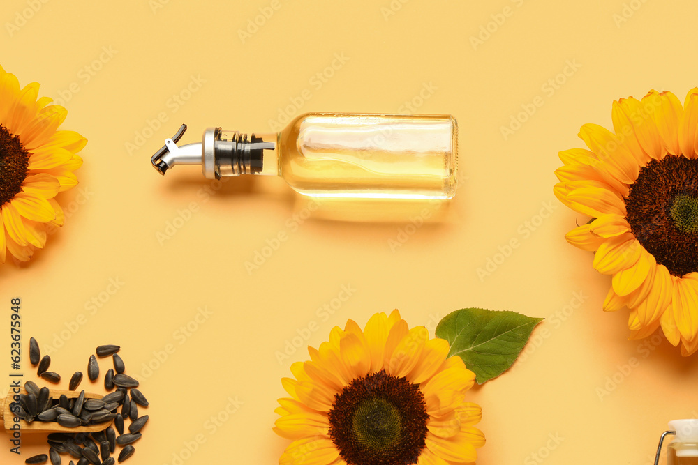 Sunflowers, seeds and bottle of oil on yellow background