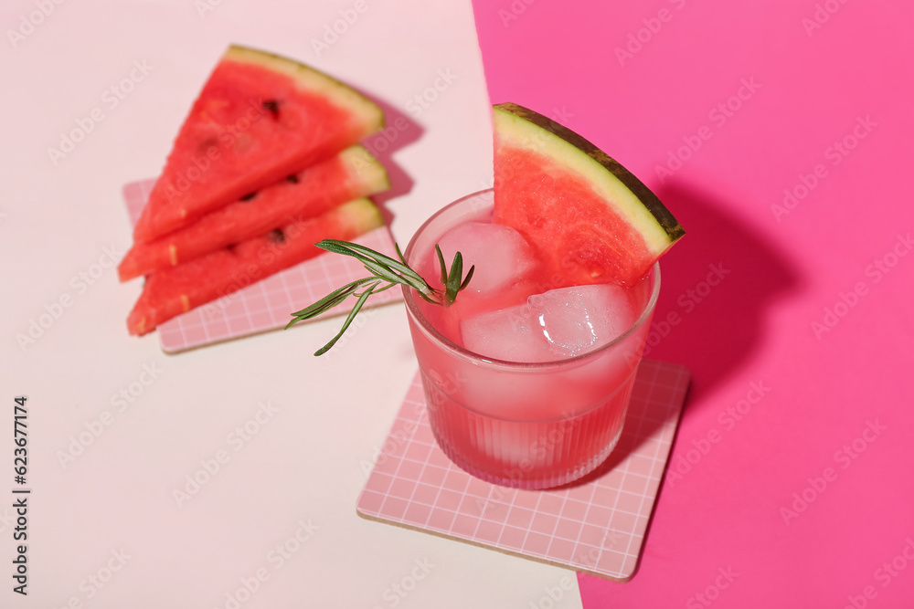 Glass of tasty watermelon cocktail on color background