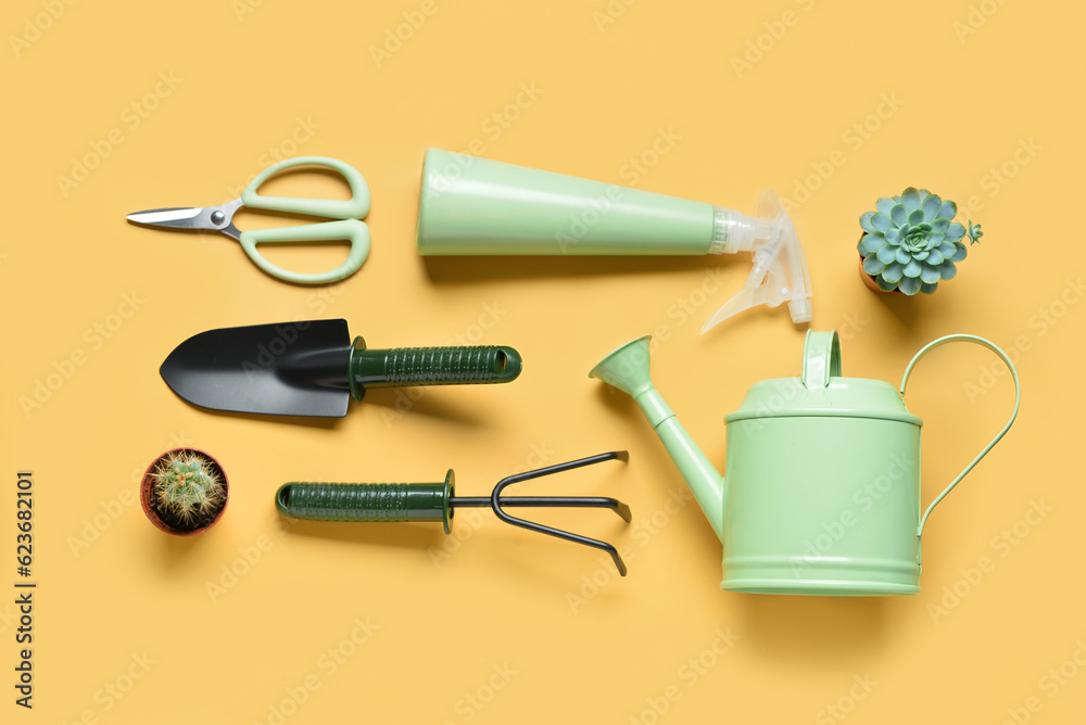 Set of gardening tools on yellow background