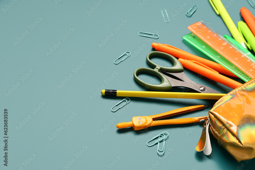 Pencil case with stationery on blue background