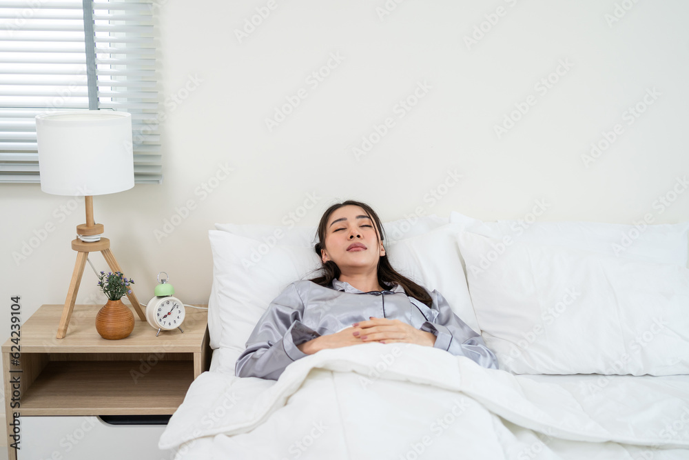 Asian young beautiful girl sleeping with happiness in bedroom at home. 