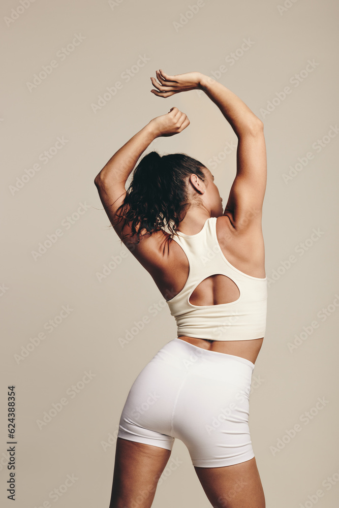 Woman with lean physique engaging in a muscle toning workout