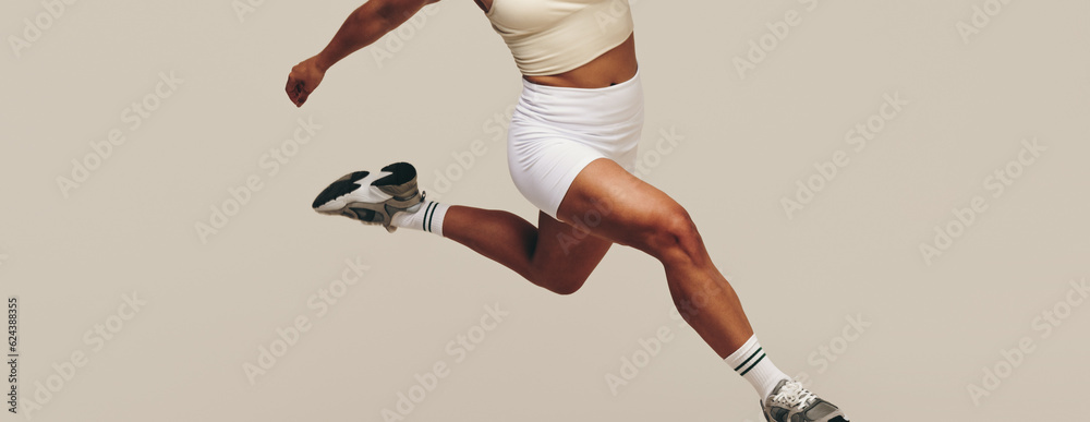 Young female athlete running in a workout session