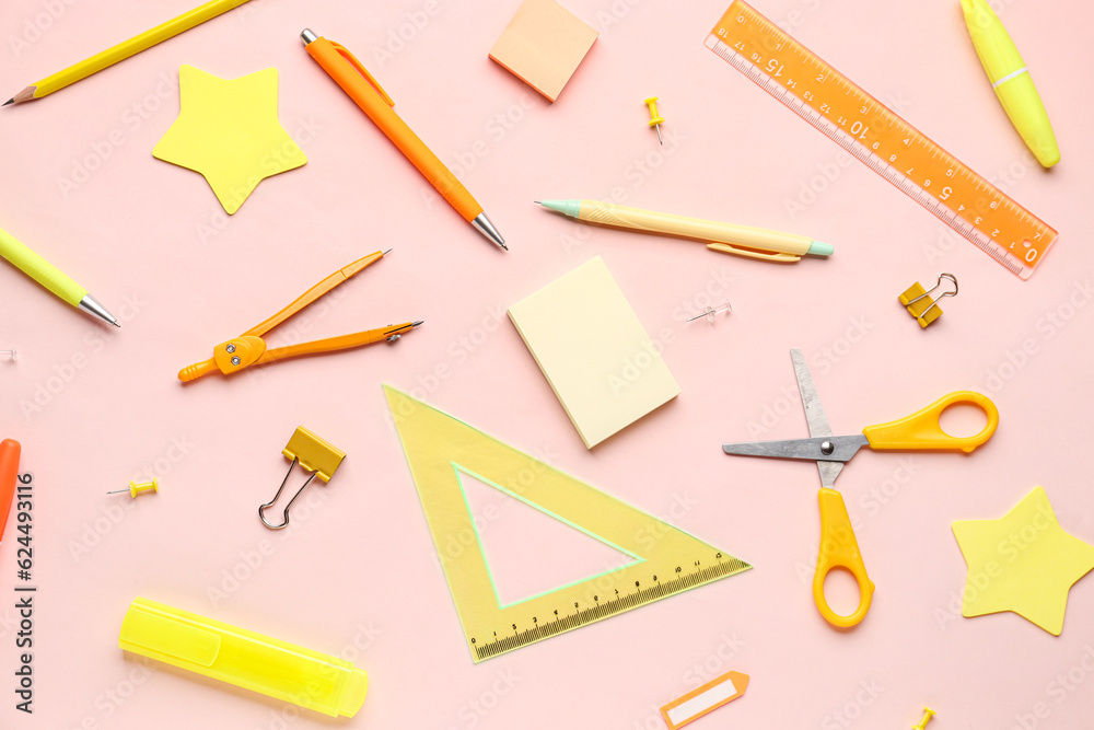 Composition with stationery supplies on pink background