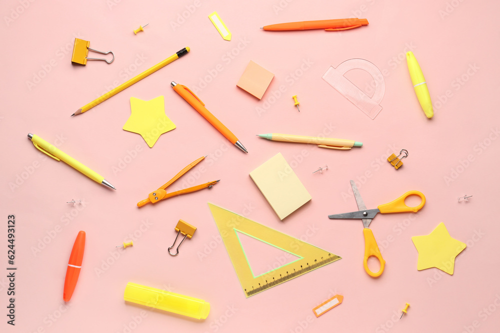 Composition with stationery supplies on pink background