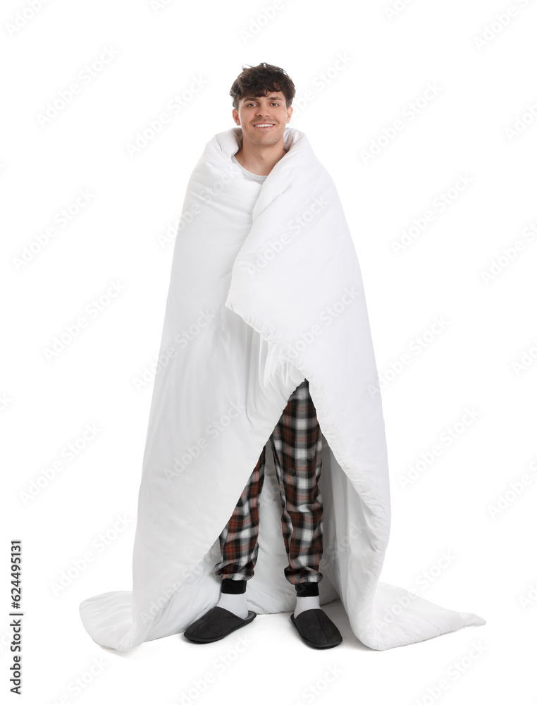 Handsome happy man with soft blanket on white background