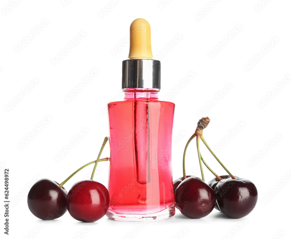 Bottle of essential oil and sweet cherry on white background