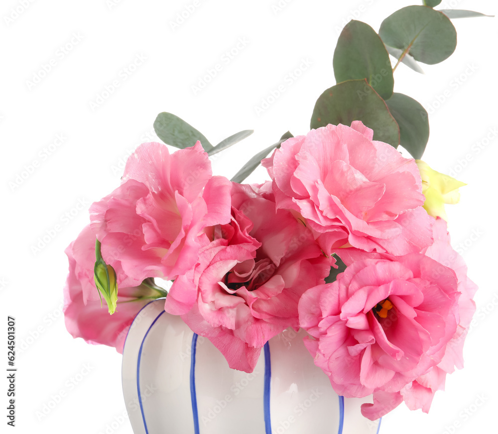 Vase with beautiful pink eustoma flowers on white background