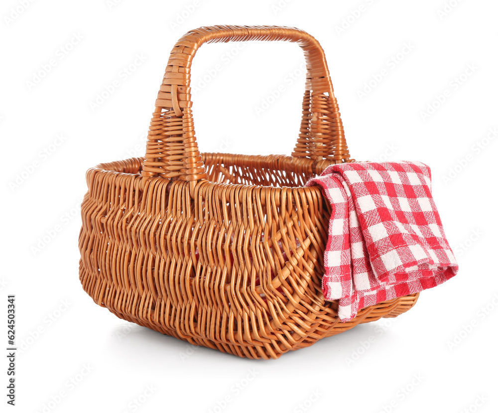 Wicker picnic basket and clean napkin on white background