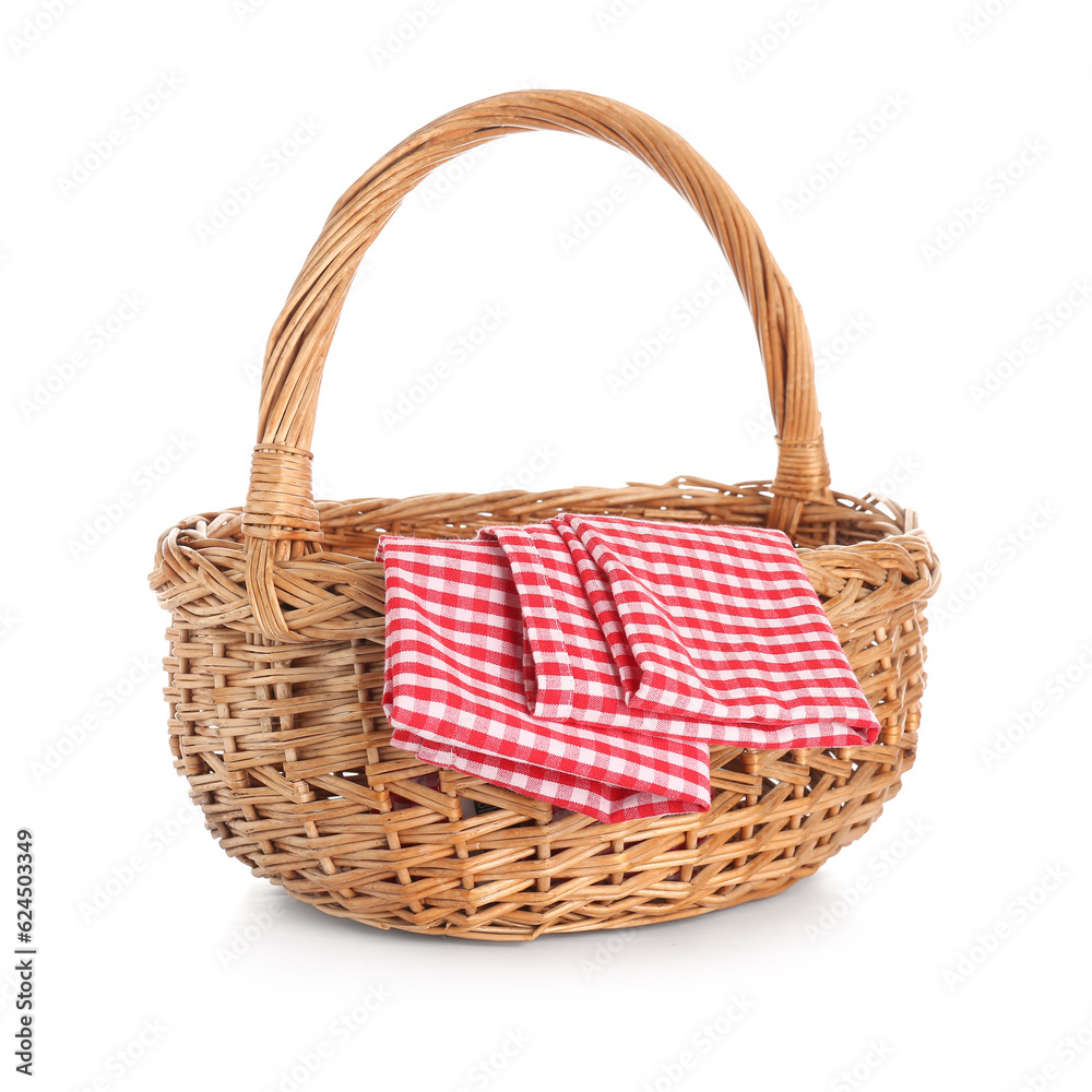 Wicker picnic basket with clean napkins on white background