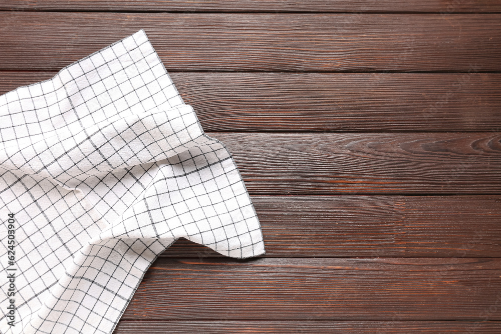 Clean napkin on dark wooden background