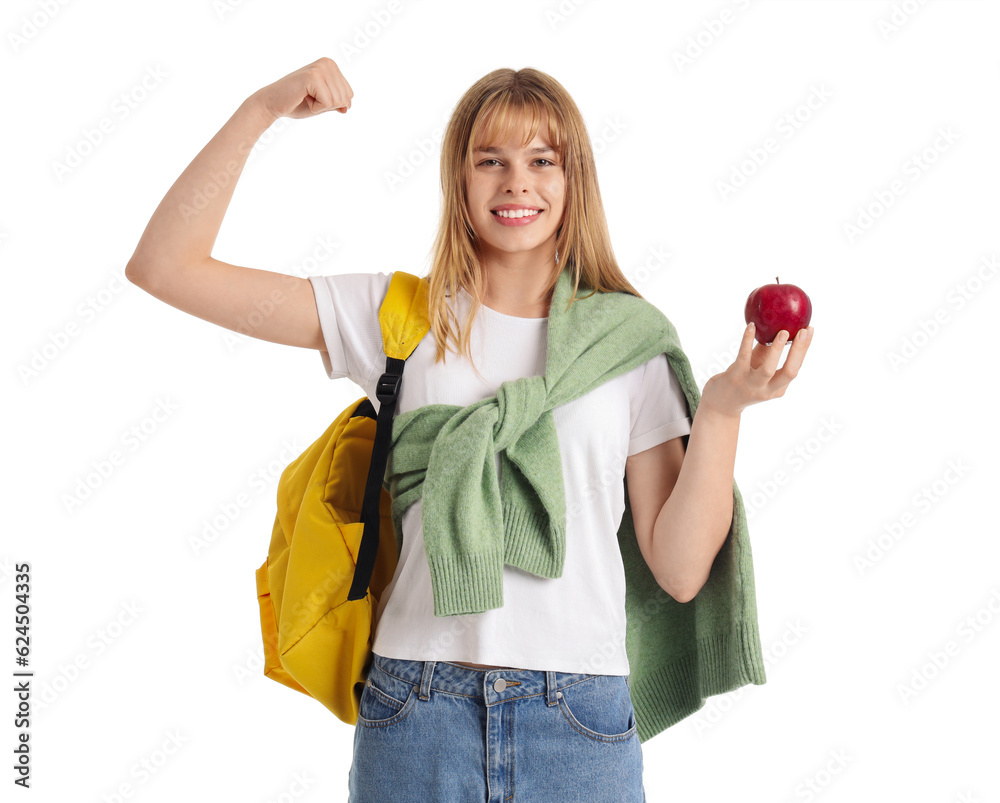 Female student with apple showing muscles on white background