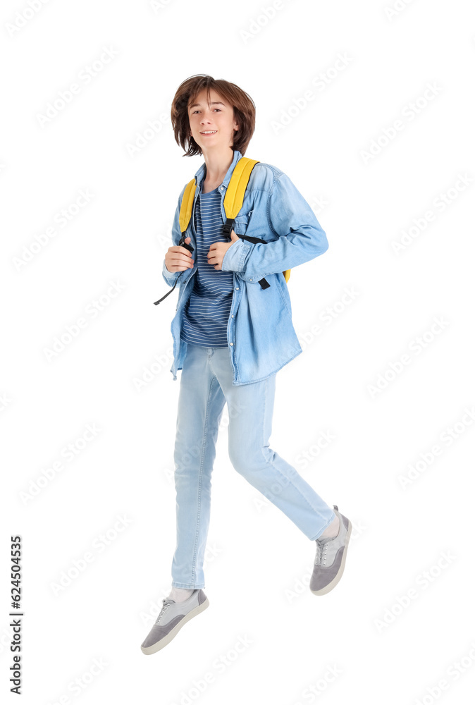 Male student jumping on white background