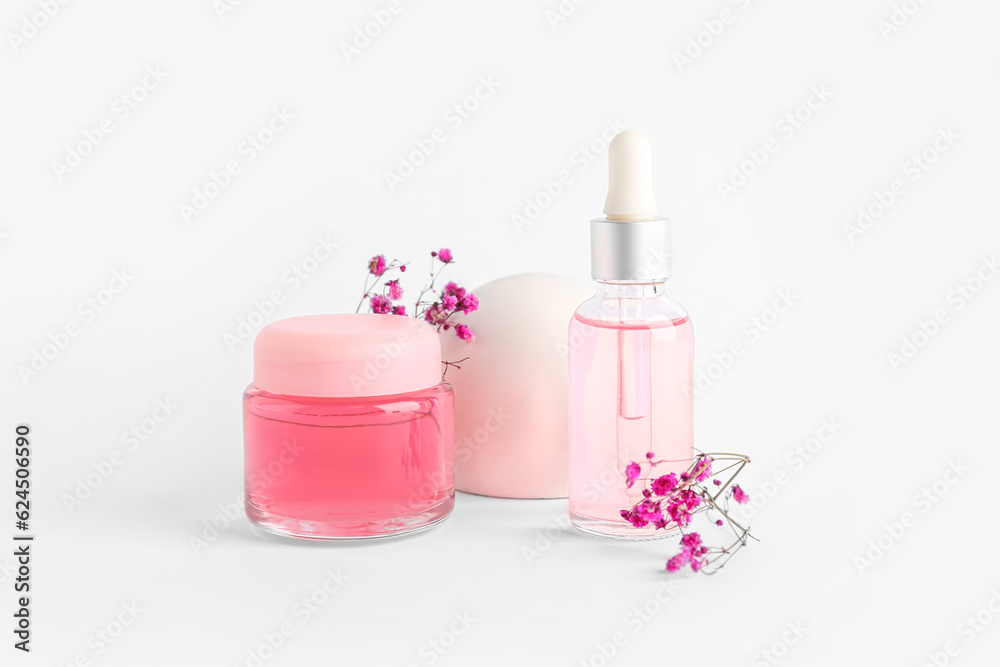 Cosmetic products, plaster decor and gypsophila flowers on light background