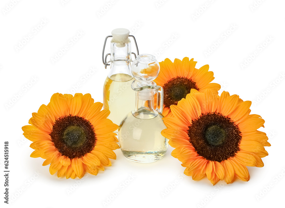 Bottle and decanter with sunflower oil on white background