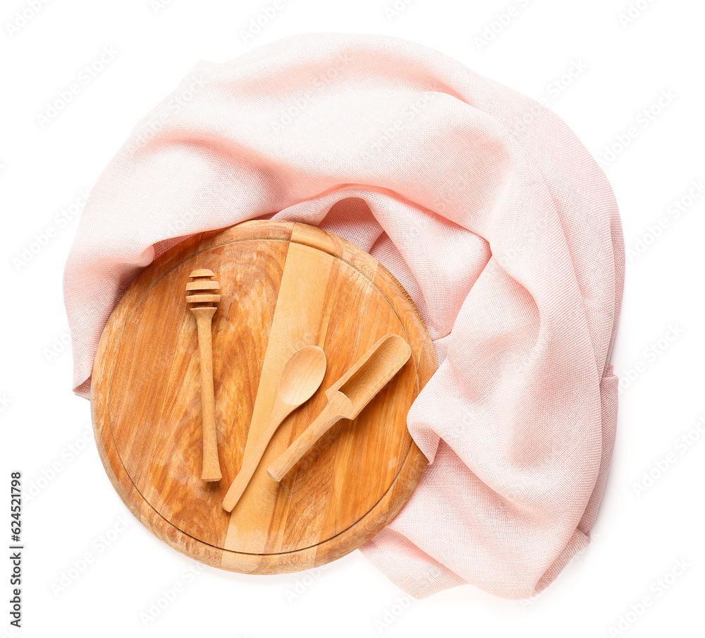 Wooden kitchen utensils and pink napkin on white background