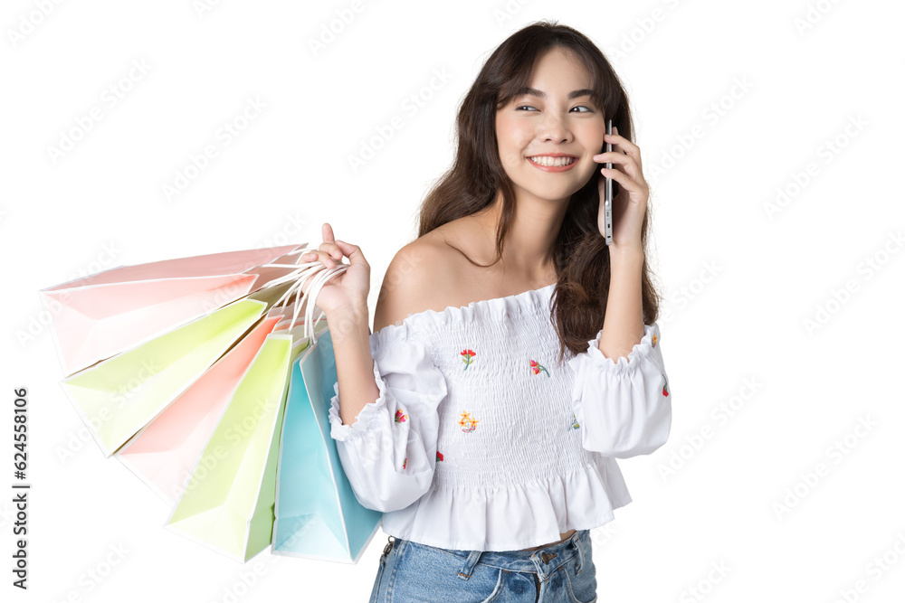 Young Asian woman usin shopping bag using phone on isolate background