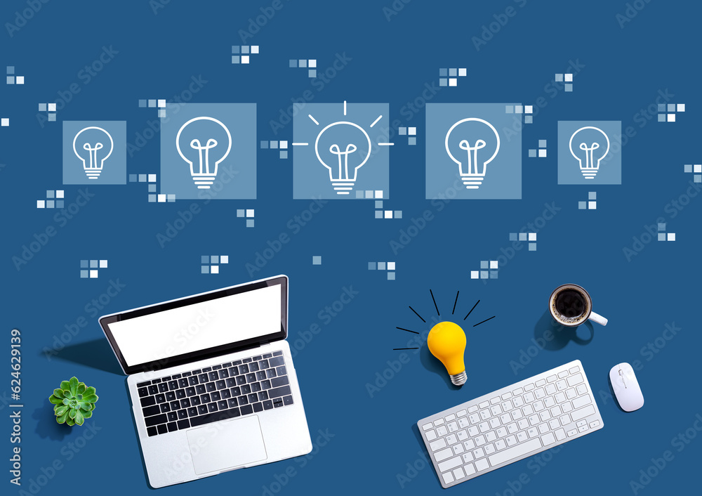 Idea light bulb theme with computers with a light bulb from above