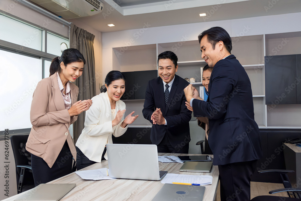 Business man and woman work together, celebrate success in start up office. Creative team brainstorm