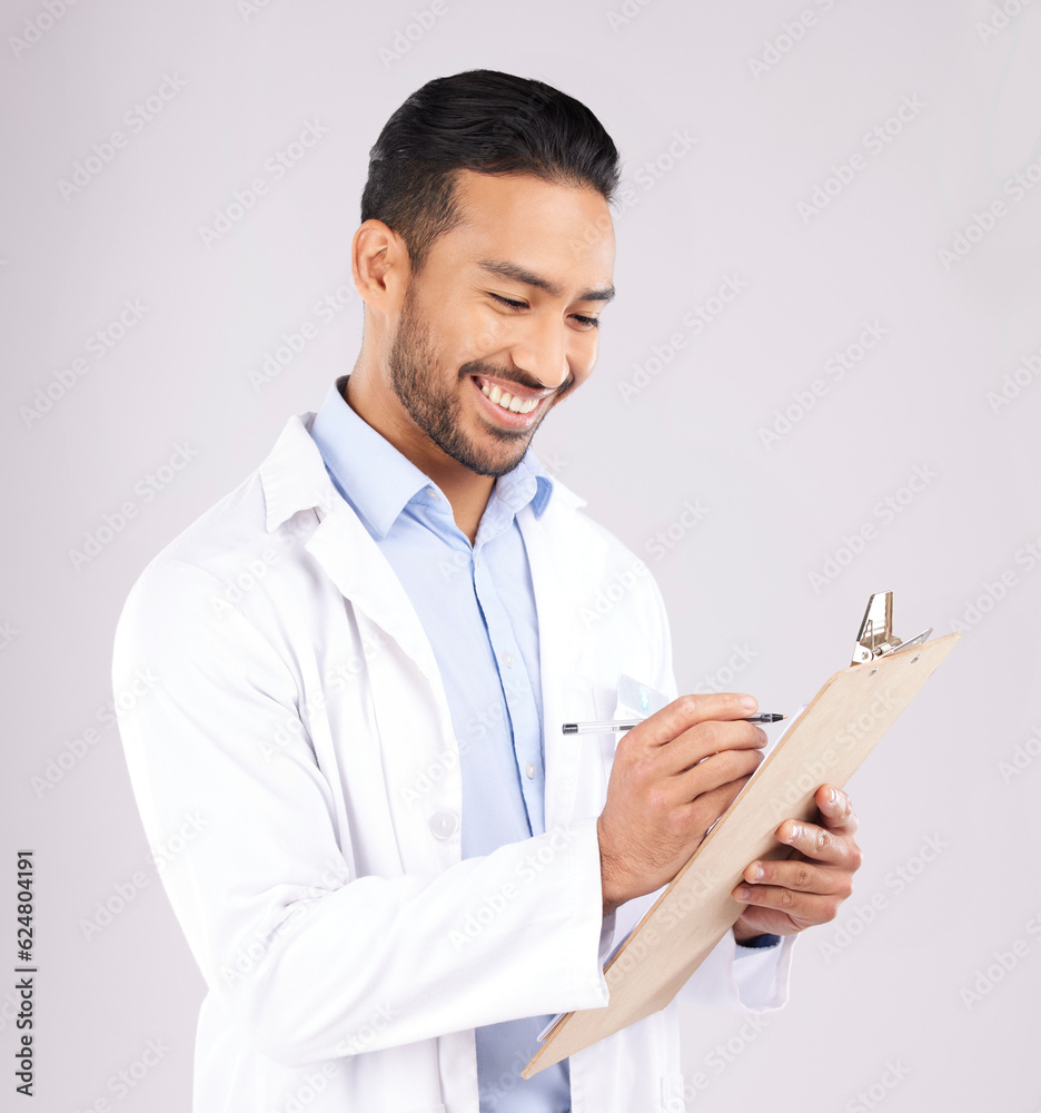 Writing, smile and happy man doctor with checklist in studio for medical, compliance or insurance on