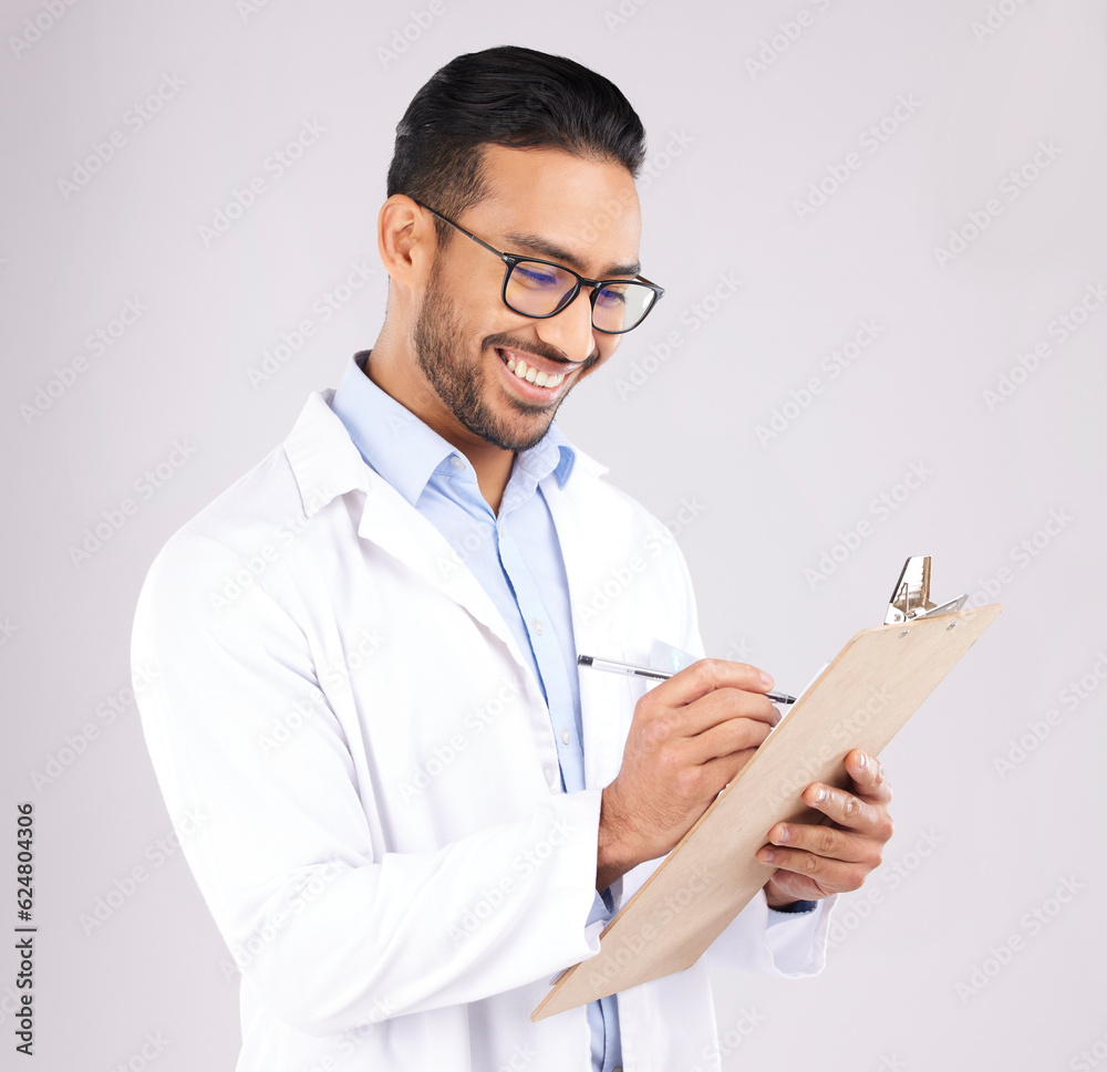 Happy man, doctor and writing on clipboard in studio, planning documents and healthcare schedule. As