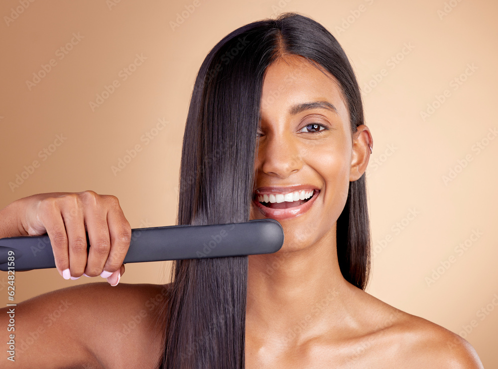 Portrait, hair and flat iron with a model woman in studio on a beige background for beauty or style.