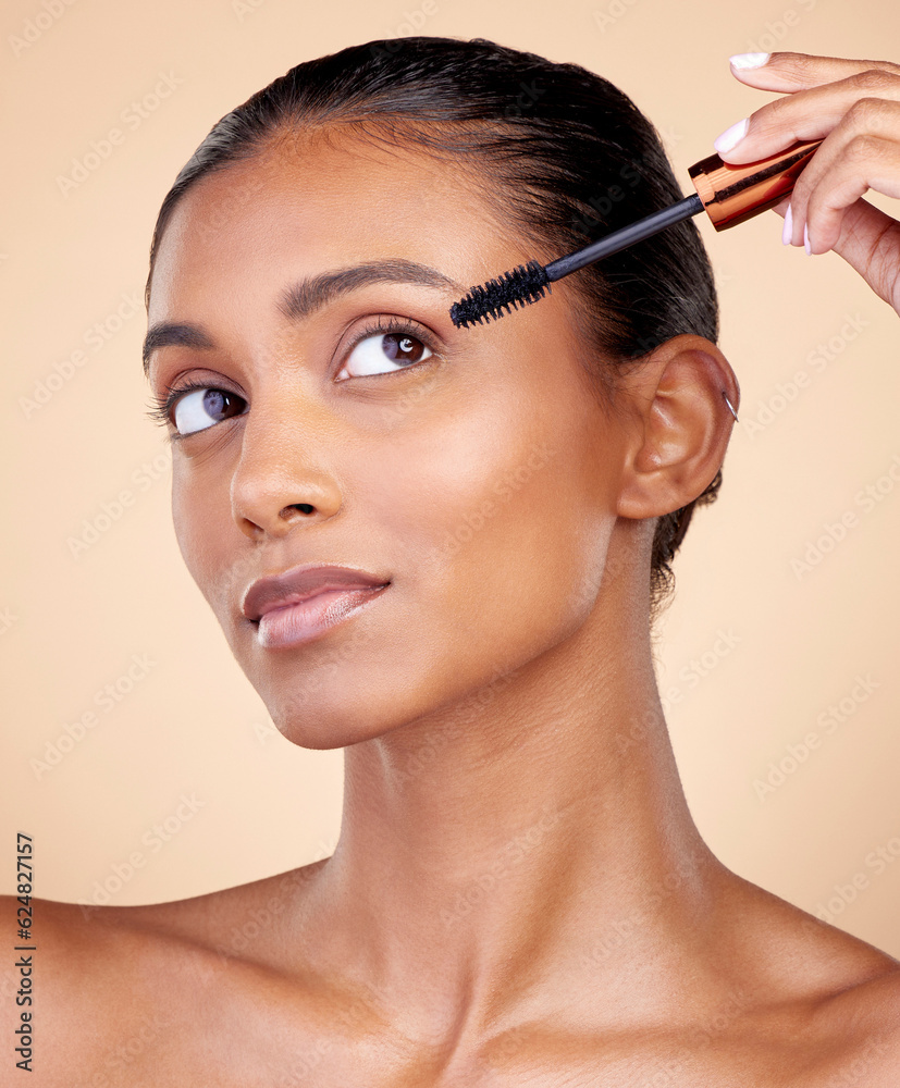 Face, mascara brush and woman, beauty and makeup with cosmetics tools isolated on studio background.