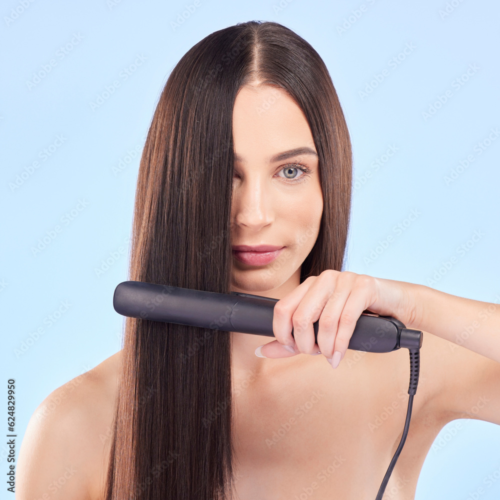 Portrait, woman and hair iron for beauty in studio, cosmetic treatment or shine on blue background. 