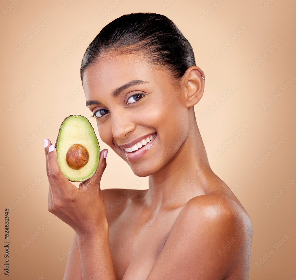 Avocado, beauty and portrait of happy woman in studio, background and aesthetic glow. Face of indian