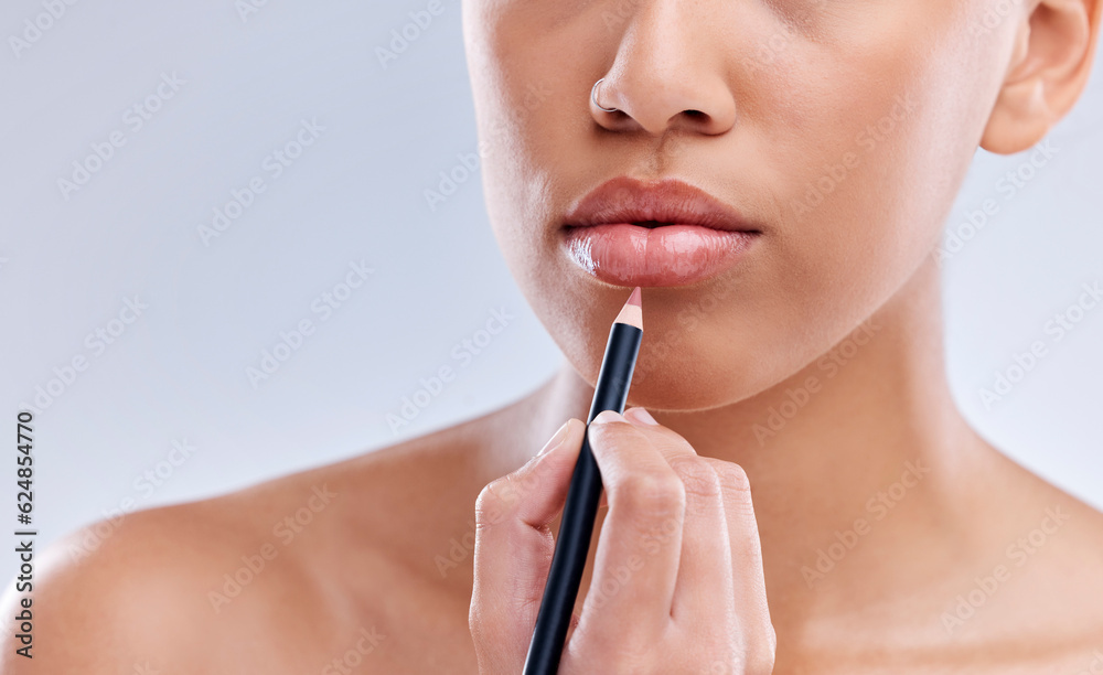 Makeup, mouth and woman with lip pencil in studio for beauty, cosmetics and color on grey background