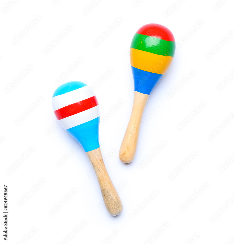 Colorful maracas on white background, top view