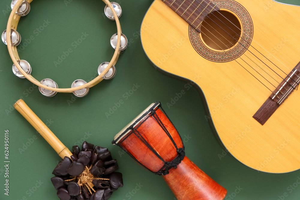 Different musical instruments on color background