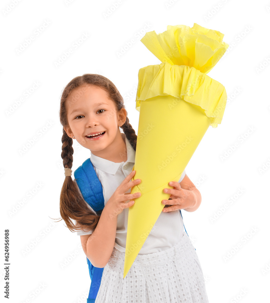 Little girl with backpack and yellow school cone isolated on white background