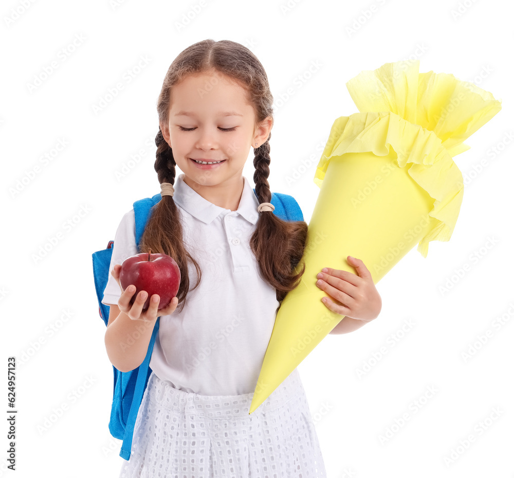 Little girl with backpack, yellow school cone and fresh apple isolated on white background