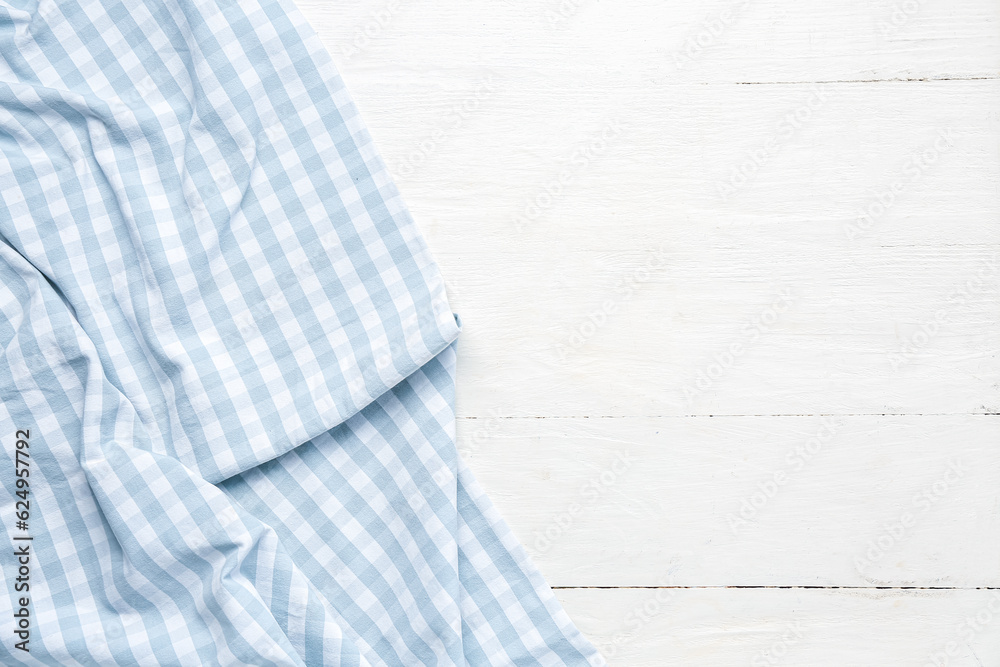 Clean napkin on light wooden background