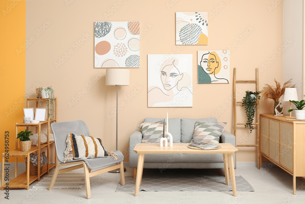 Modern living room interior with grey sofa, armchair and shelving unit