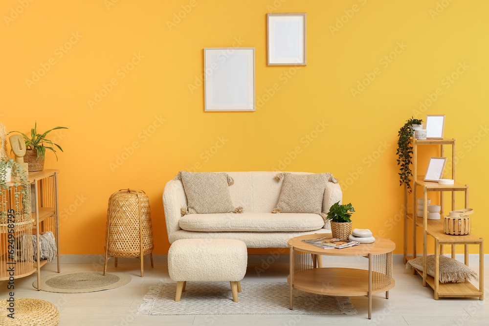 Modern living room interior with comfortable white sofa, shelving units and wooden coffee table