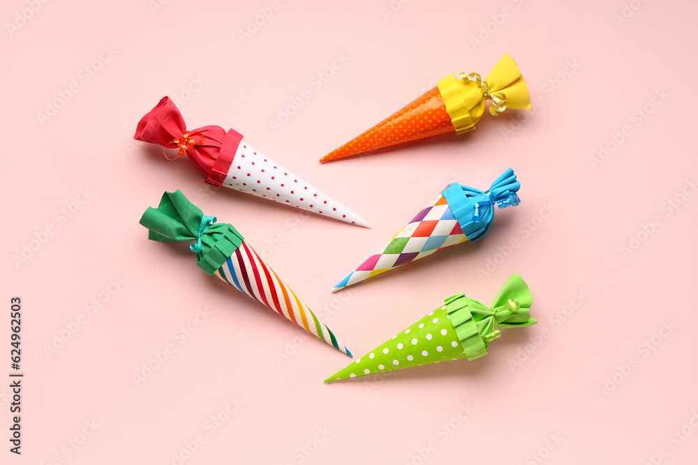 Colorful school cones on pink background