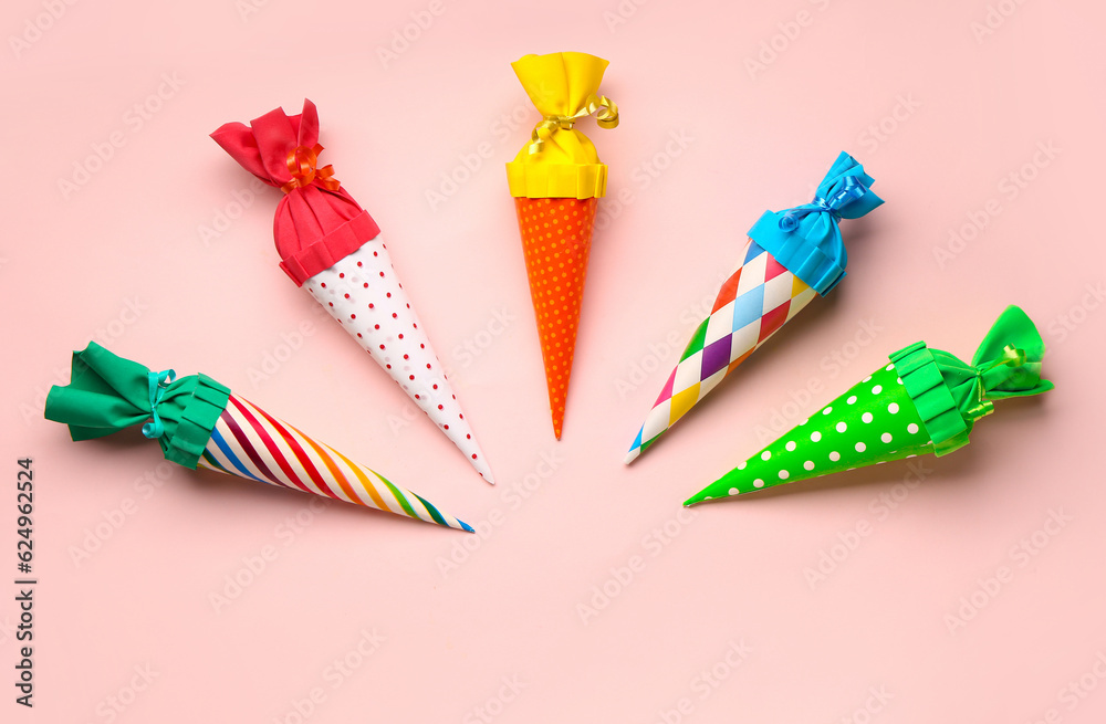 Colorful school cones on pink background