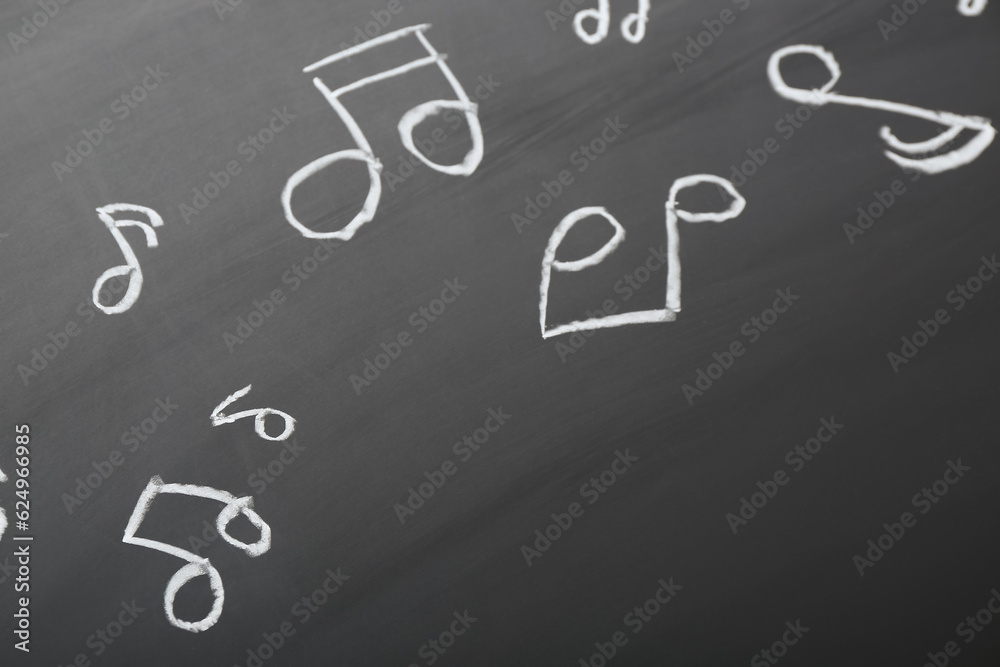 Different music notes on black background