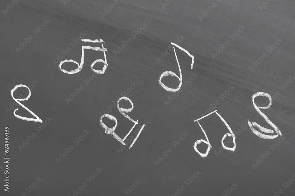 Different music notes on black background