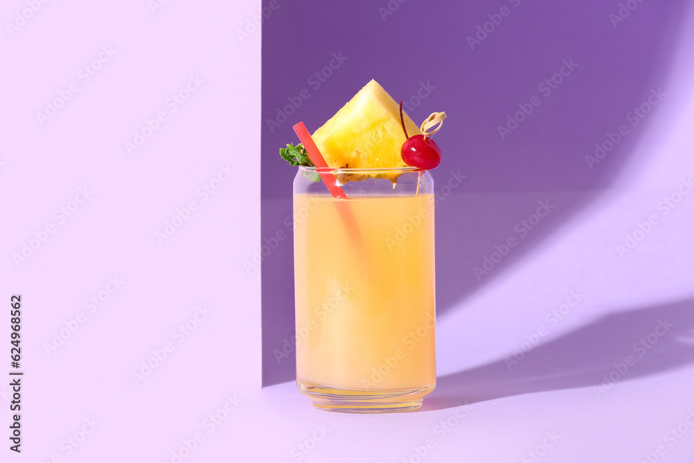 Glass of tasty mai tai cocktail on lilac background